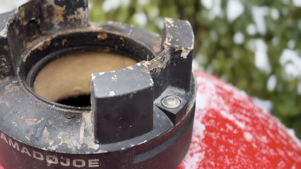 Black Kontrol Tower base with chipped paint and exposed metal around the vent openings