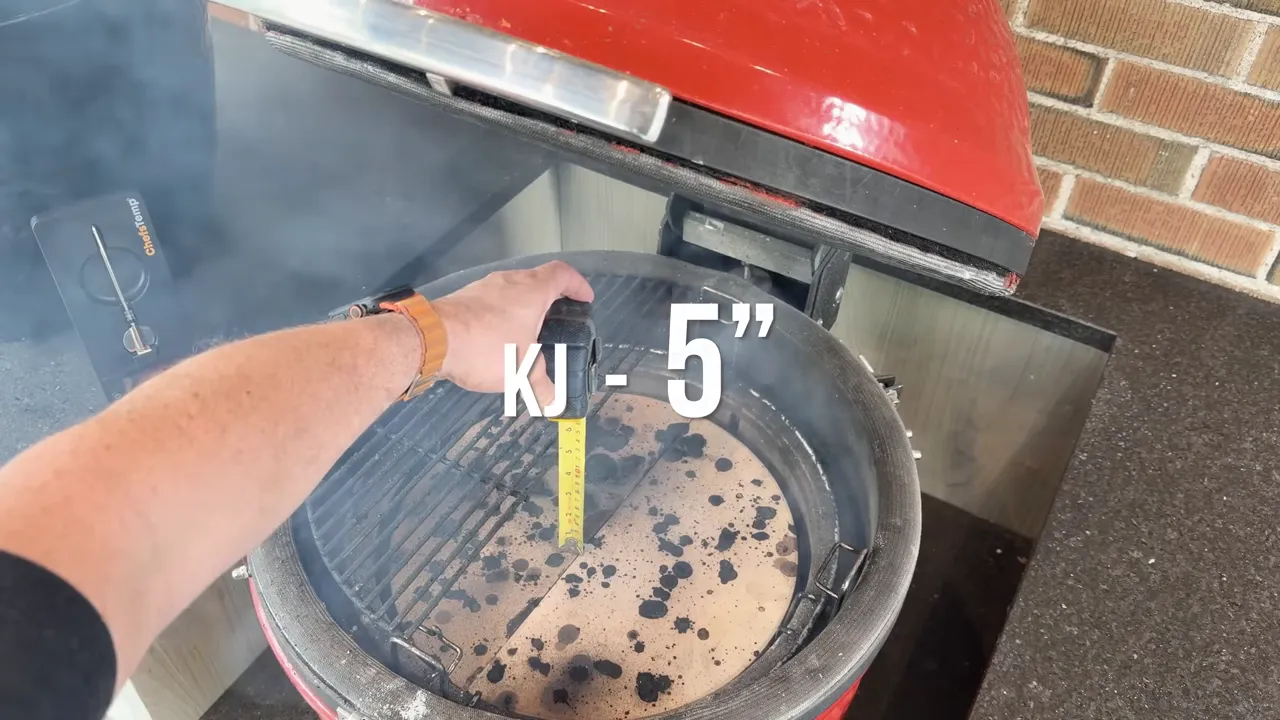 Tape measure inside a red kamado with an overlay reading KJ 5 inches