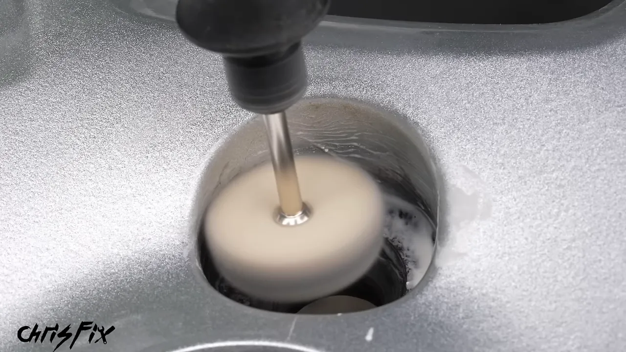 Small wool buffing wheel polishing the inside of a lug nut recess
