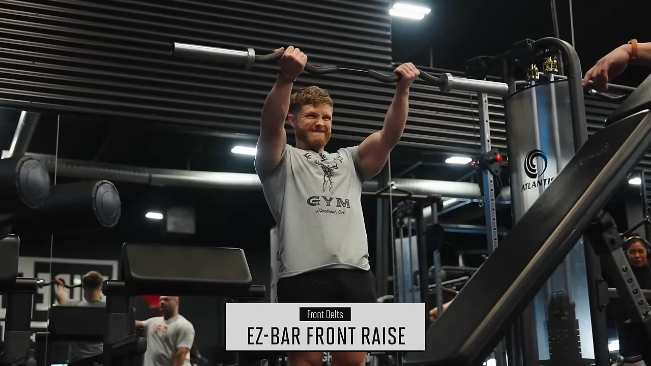 Jeff holding an EZ-bar overhead with nearly straight arms
