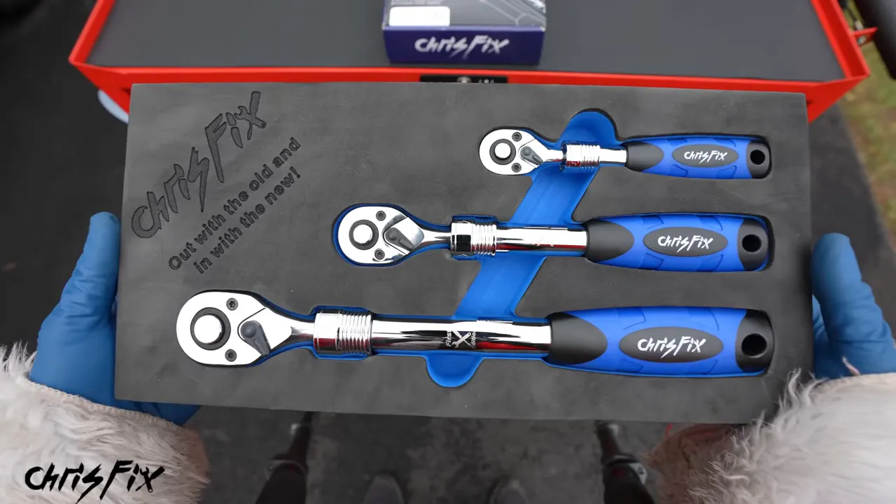 Three blue-handled ChrisFix ratchets arranged in a fitted black foam tray