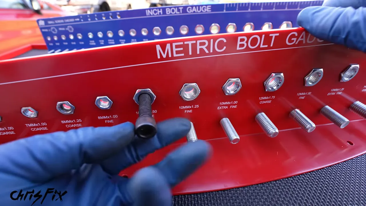 Metric bolt gauge with labeled threaded holes and studs