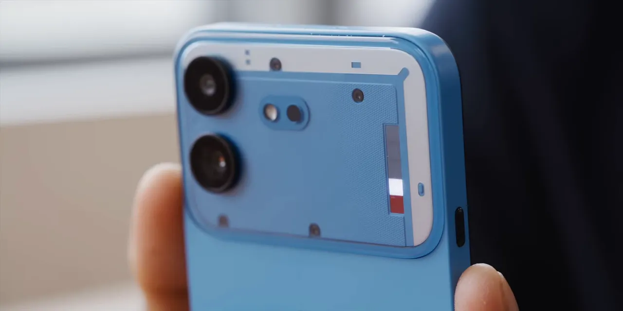Close-up of the blue Phone 4b with white Glyph LEDs illuminated beside the rear cameras
