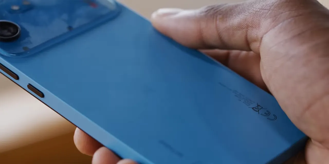 Close-up of the blue phone back showing surface marks near the lower portion