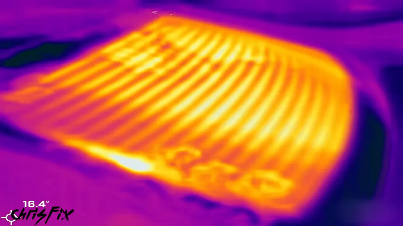 Thermal image showing bright heated grid lines across the rear window