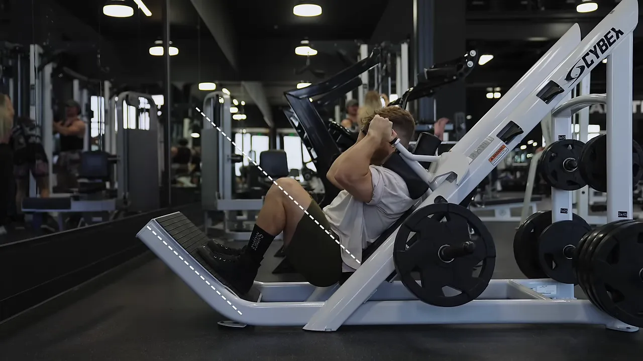 Side view of a lifter in the bottom position of a hack squat