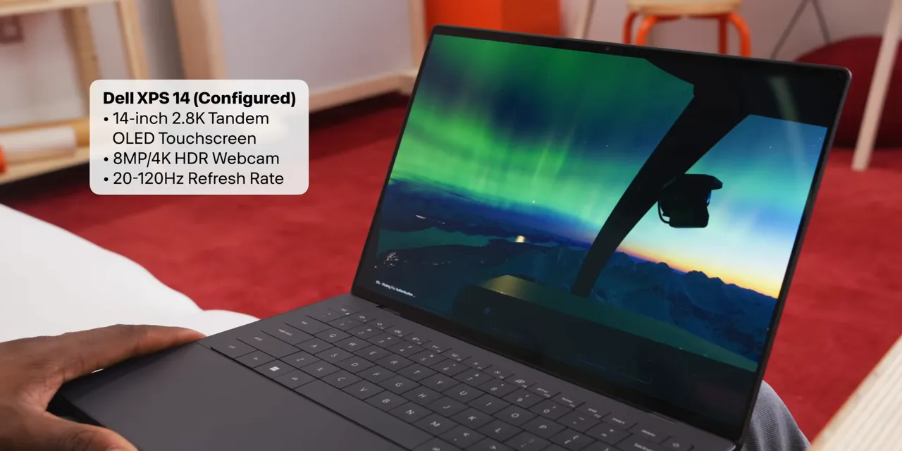 Dell XPS 14 displaying an aurora scene with an overlay listing its display specifications