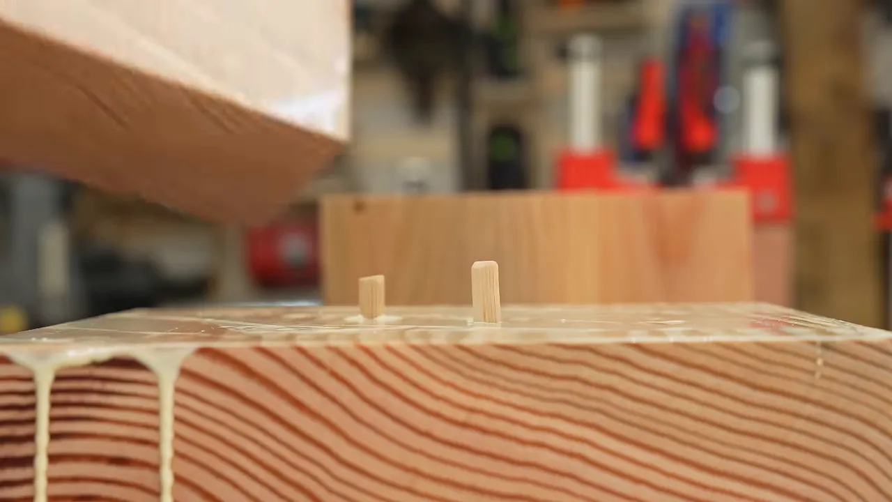 Douglas fir blocks with glue and alignment dowels projecting from their upper faces