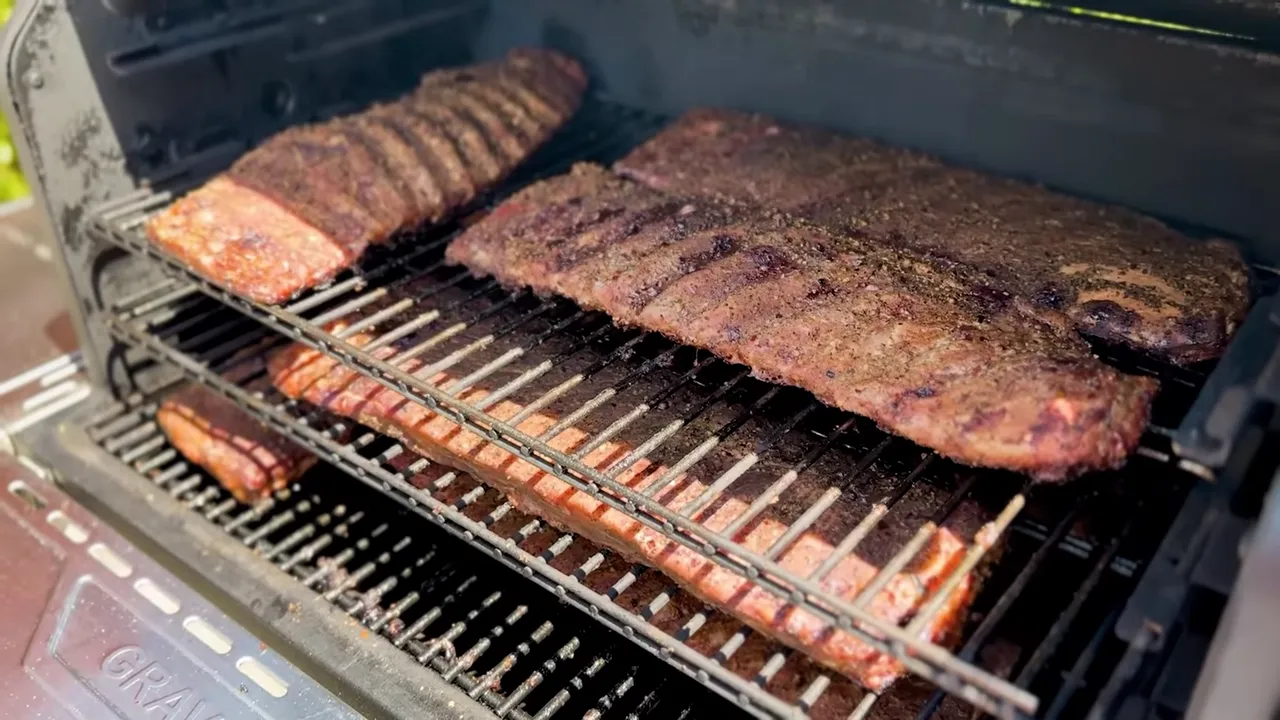 Seasoned rib racks arranged across three levels inside the Gravity XT