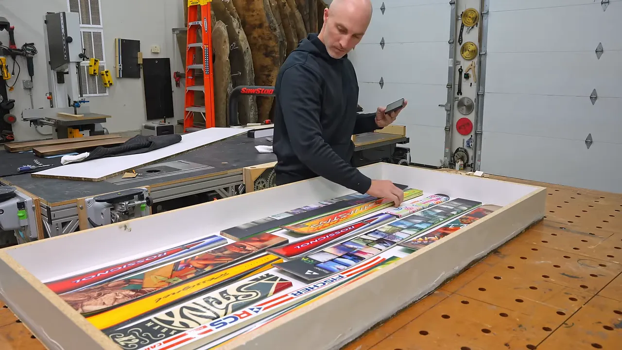 Colorful ski sections arranged inside a white melamine mold