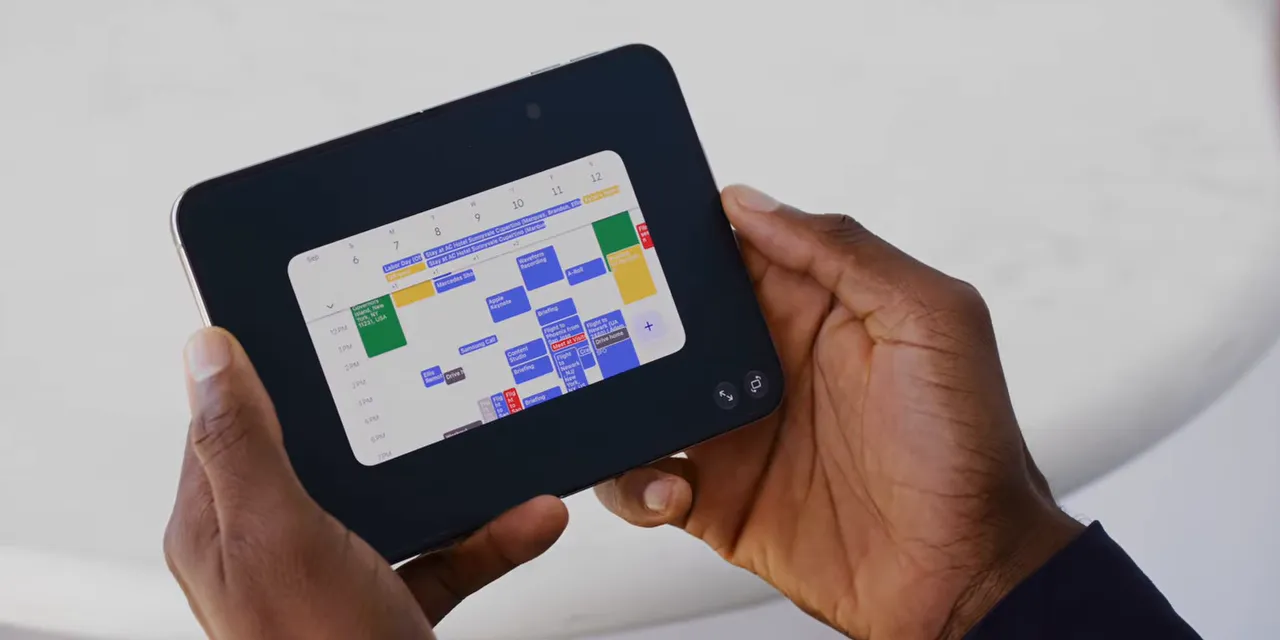 An unfolded phone showing a small calendar app surrounded by black space