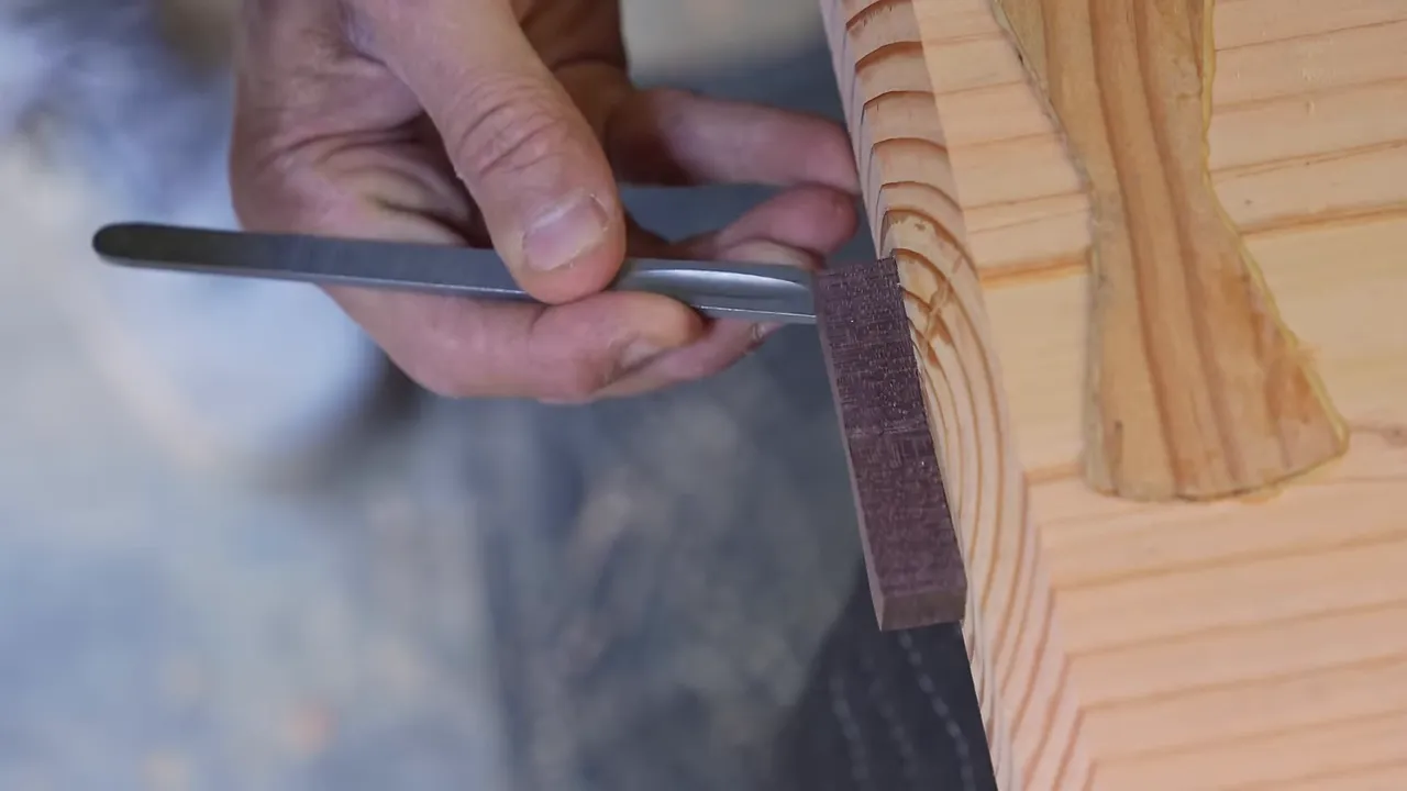 Slab edge and surface with wooden bow tie inlays crossing end cracks