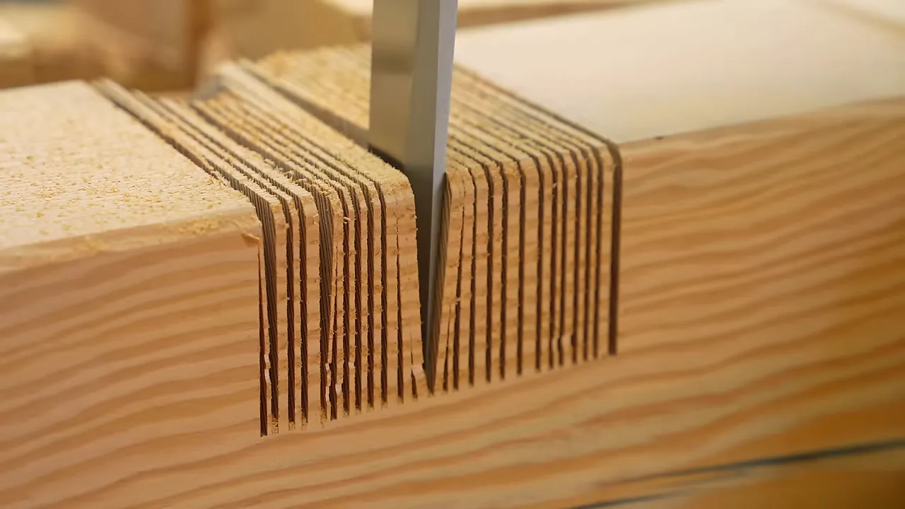 Chisel breaking thin sections of wood from a large kerfed notch