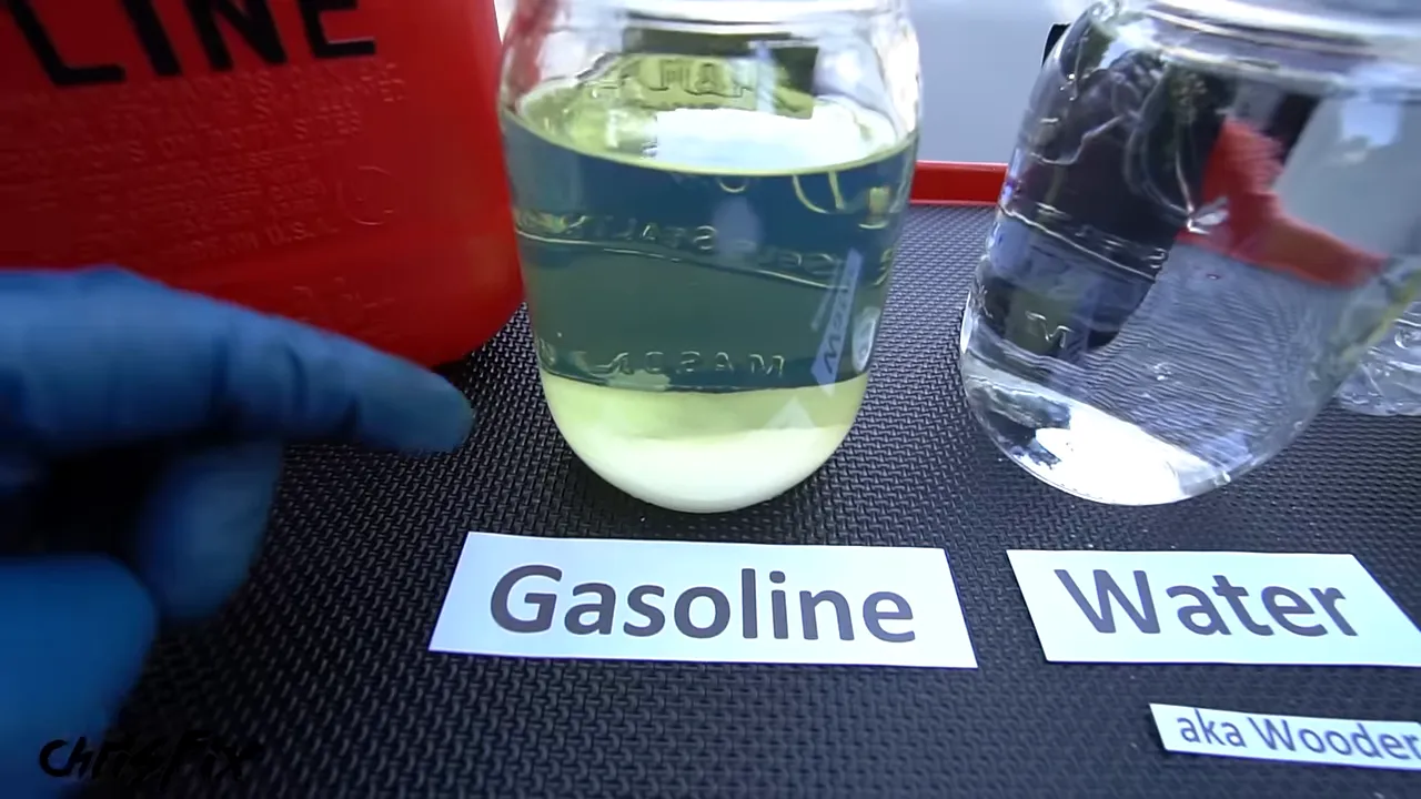Labeled gasoline and water jars with sugar settled in the gasoline jar