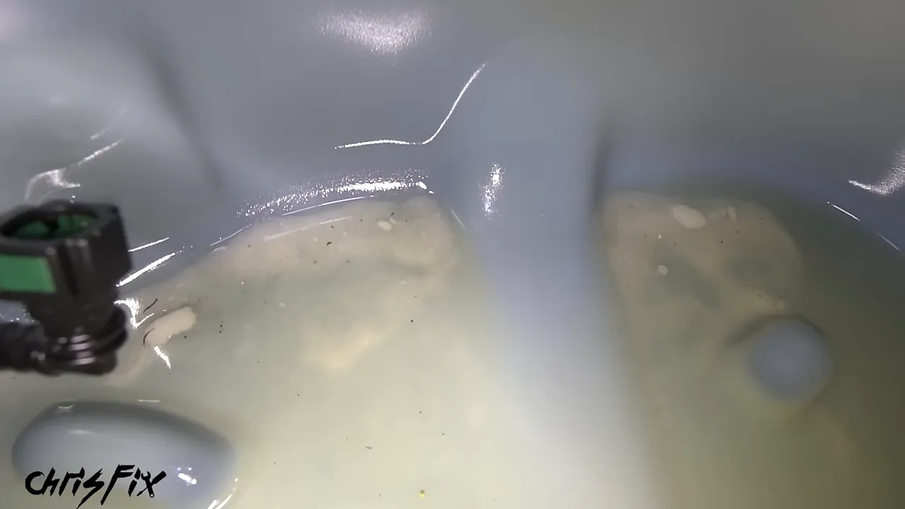 Sugar deposits visible inside the open fuel tank