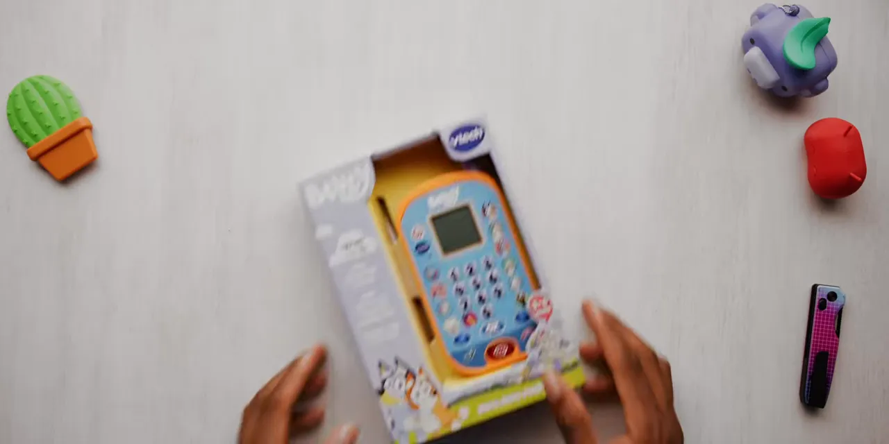 VTech Bluey Ring Phone in open-front retail packaging on a tabletop