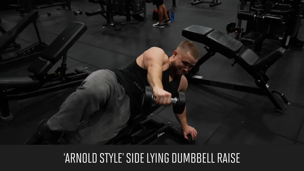 Side-lying dumbbell raise on a bench with the working arm lowered across the body