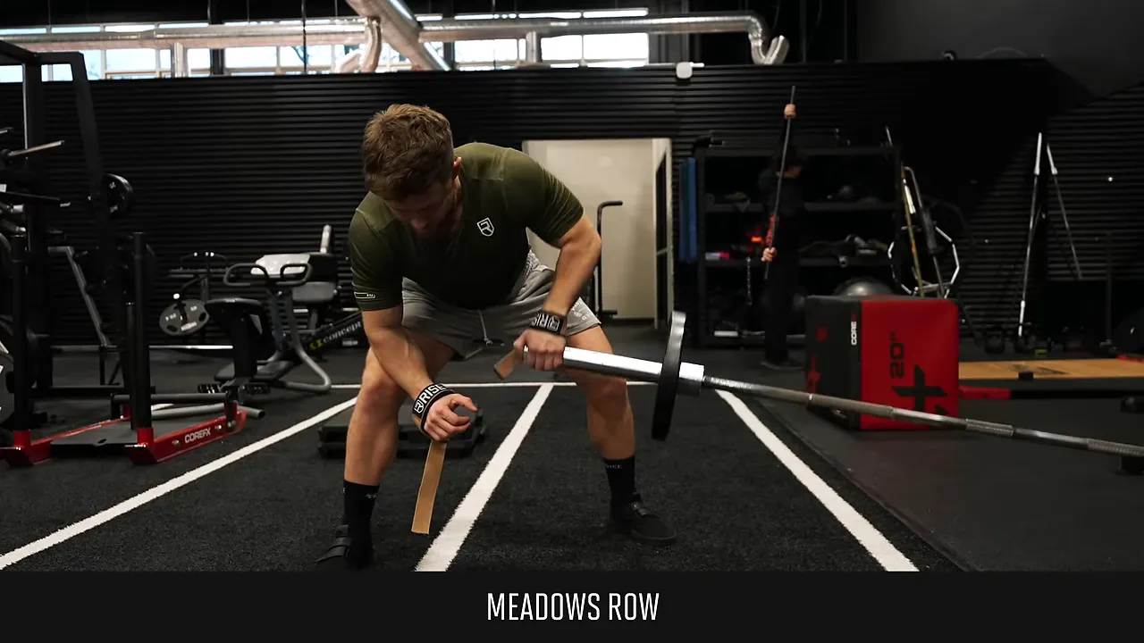 Meadows row setup with a wide stance and the free forearm braced on the thigh