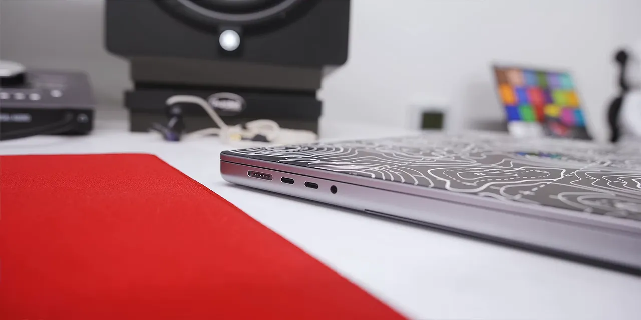 Close side view of a MacBook Pro showing several ports along its edge