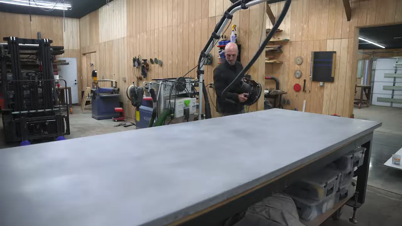 Finished gray concrete tabletop with softly rounded corners and an even matte surface