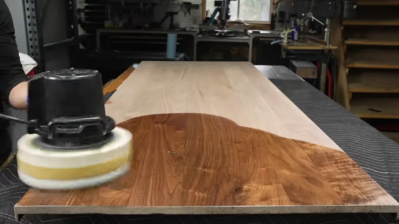 Walnut door face partly coated with finish, showing a darker finished area beside pale unfinished wood
