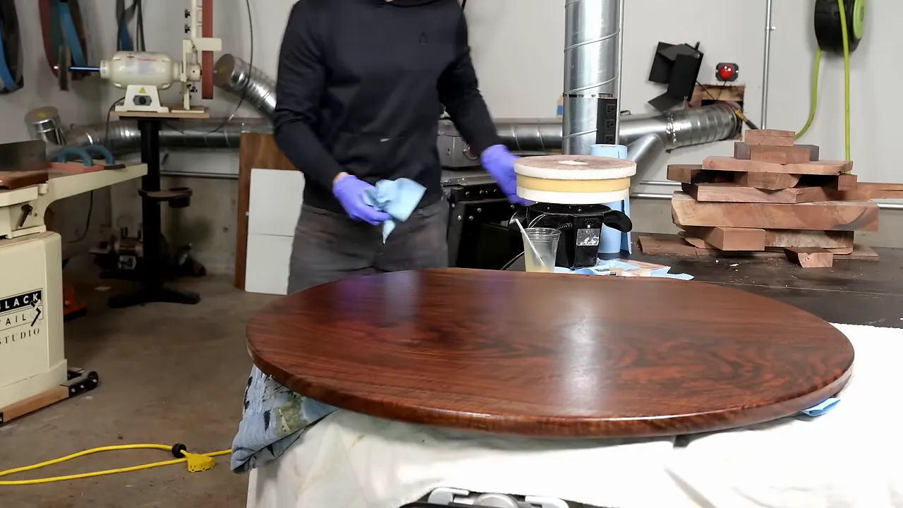 Finished walnut tabletop with dark swirling grain and fine rippling figure near the edge