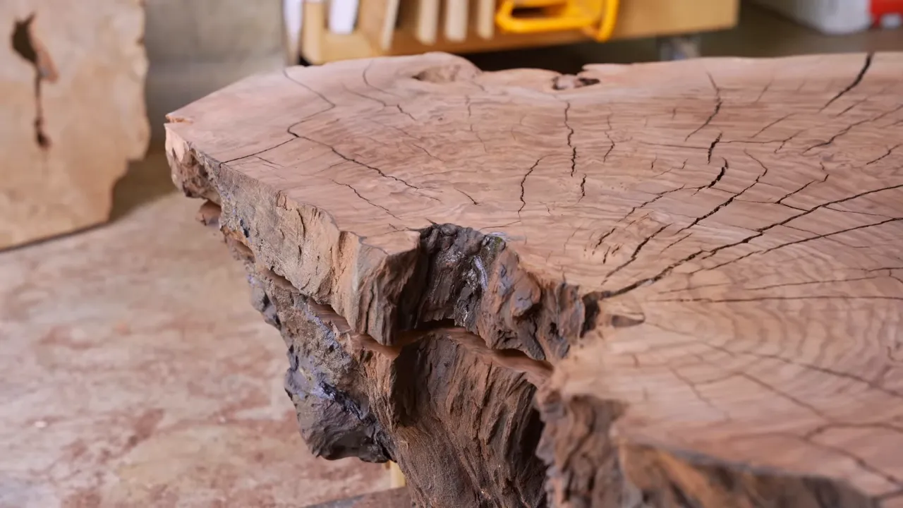 Deep horizontal slot cut into the side of the walnut burl