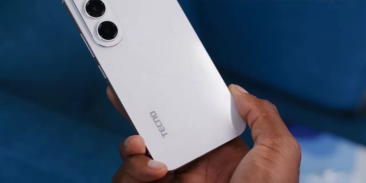 Close-up of the white Tecno phone back with three camera rings and a faint reflective pattern
