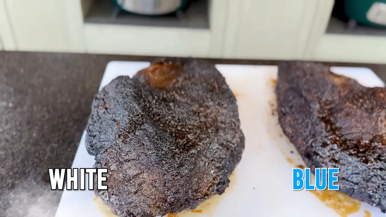 Two whole cooked briskets on a white board labeled WHITE and BLUE