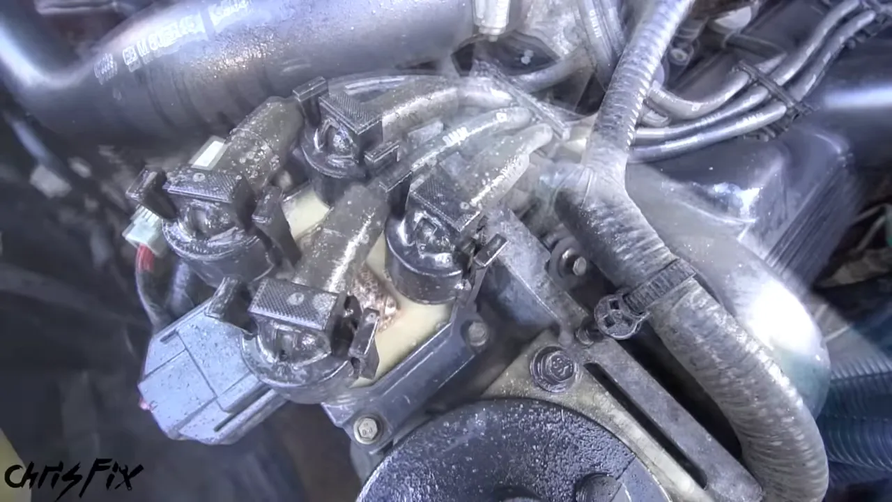 Toothbrush scrubbing around ignition wires and boots in the engine bay