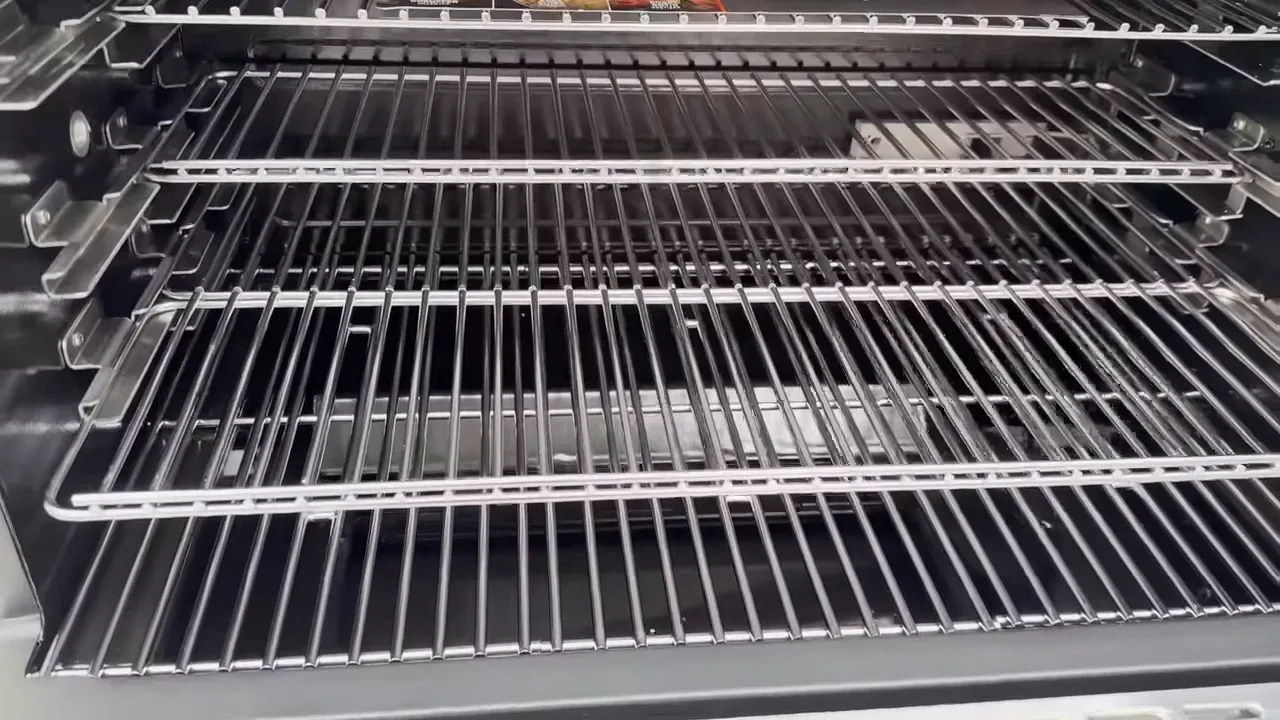 Multiple cooking racks inside the open Masterbuilt Gravity XT