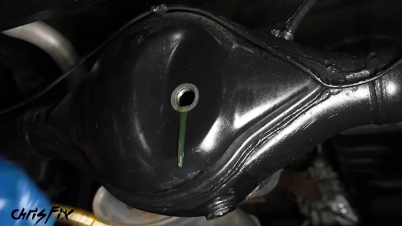 Fresh gear oil flowing from the differential fill opening