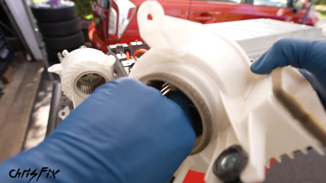 Dust and hair clogging the blades inside a Prius battery cooling fan