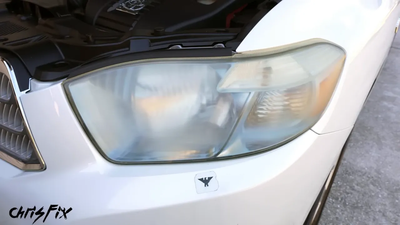 Restored clear headlight on the white Toyota Highlander