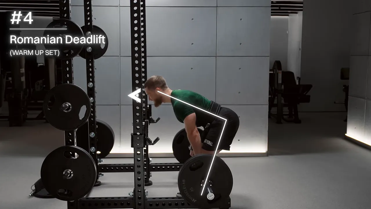 Side view of a Romanian deadlift with arrows illustrating the hip-hinge position