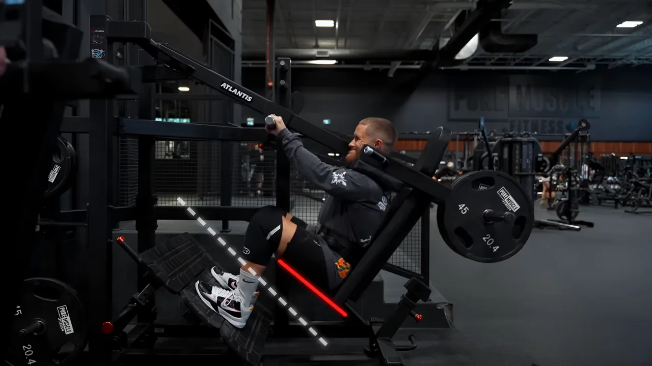 Side view of a deep pendulum squat with a green line marking the bent knee angle