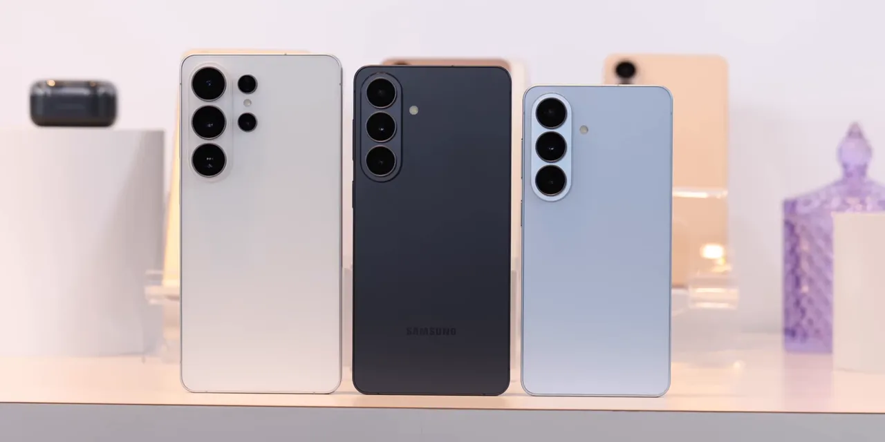 Three Samsung phones standing upright with their rear camera arrays visible