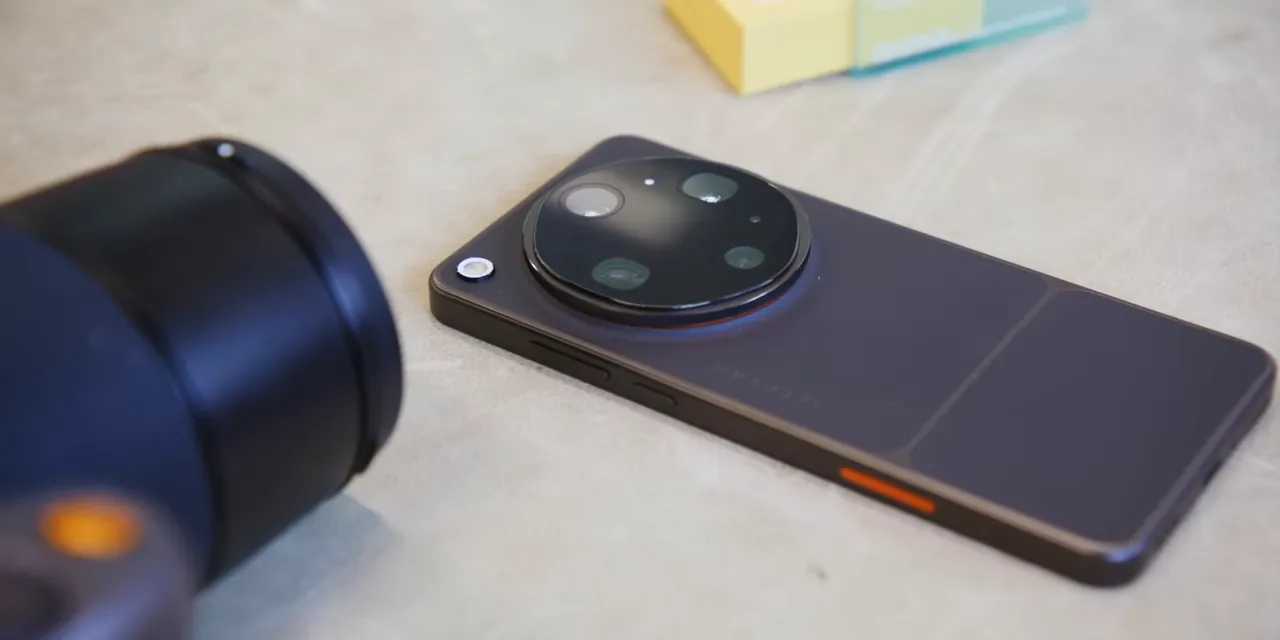 Oppo Find X9 Ultra lying on a table with a large circular camera module and orange side accent