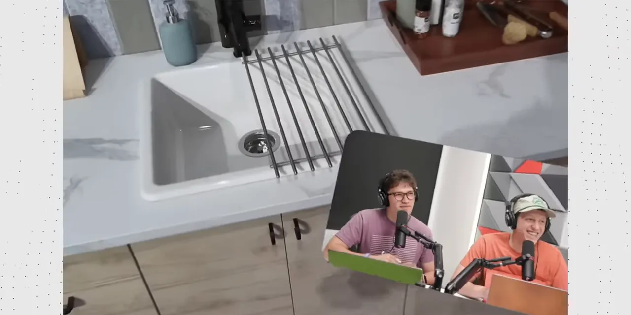 First-person view of a kitchen sink with a small floating video window near the lower right