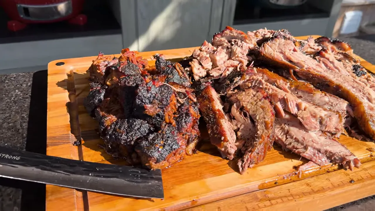Burnt ends beside broken brisket slices and loose meat on a cutting board