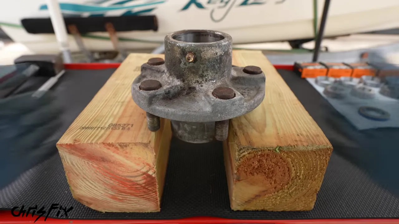 Trailer hub supported on two wood blocks with an open gap beneath it