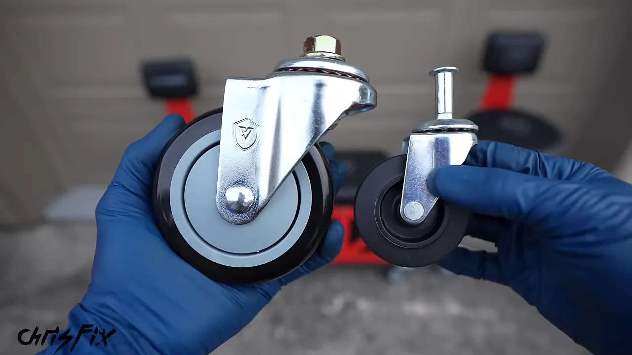 Large metal shop-chair caster held beside a much smaller caster