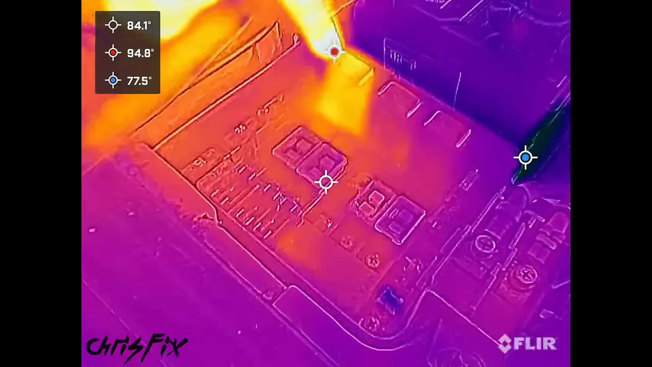 Thermal image of a fuse and relay box with one bright yellow rectangular component