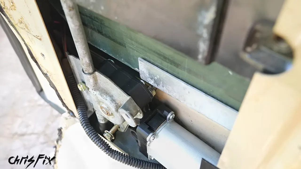 Lower window frame close to a protruding motor mounting bolt inside the door