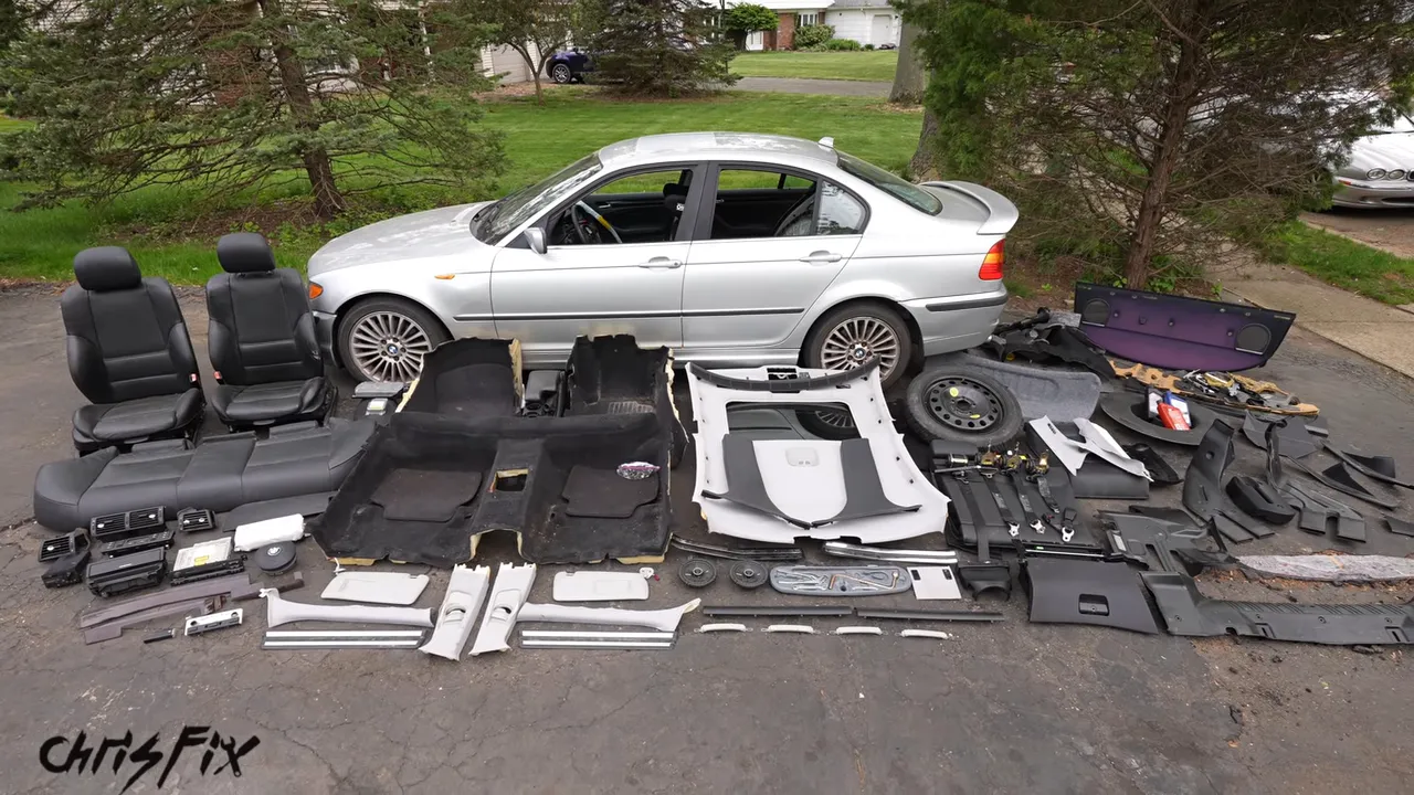 Removed seats, carpeting, trim, and sunroof parts arranged beside the BMW with a 2940-pound weight overlay