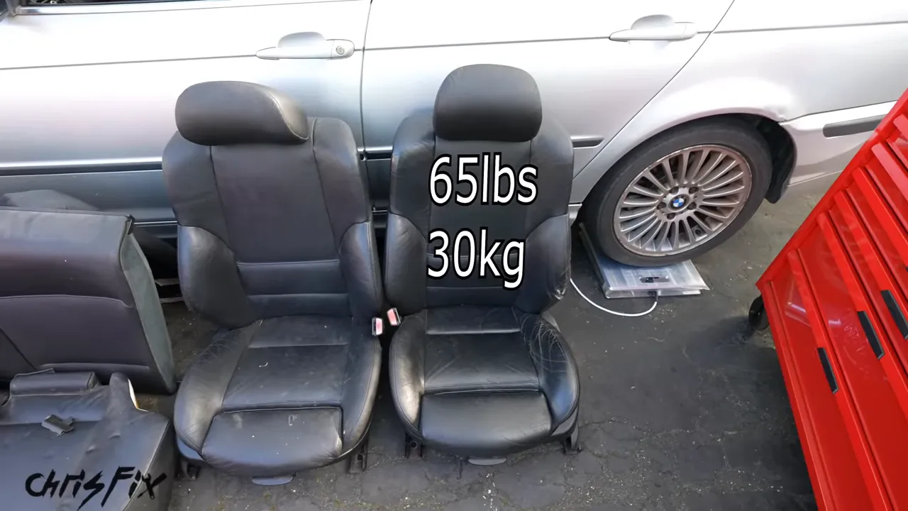 Removed BMW front and rear seats with 65-pound labels on both front seats