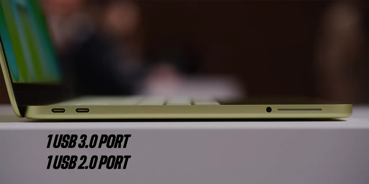 Left edge of the MacBook Neo with USB ports, headphone jack, speaker grille, and USB 3.0 and USB 2.0 labels