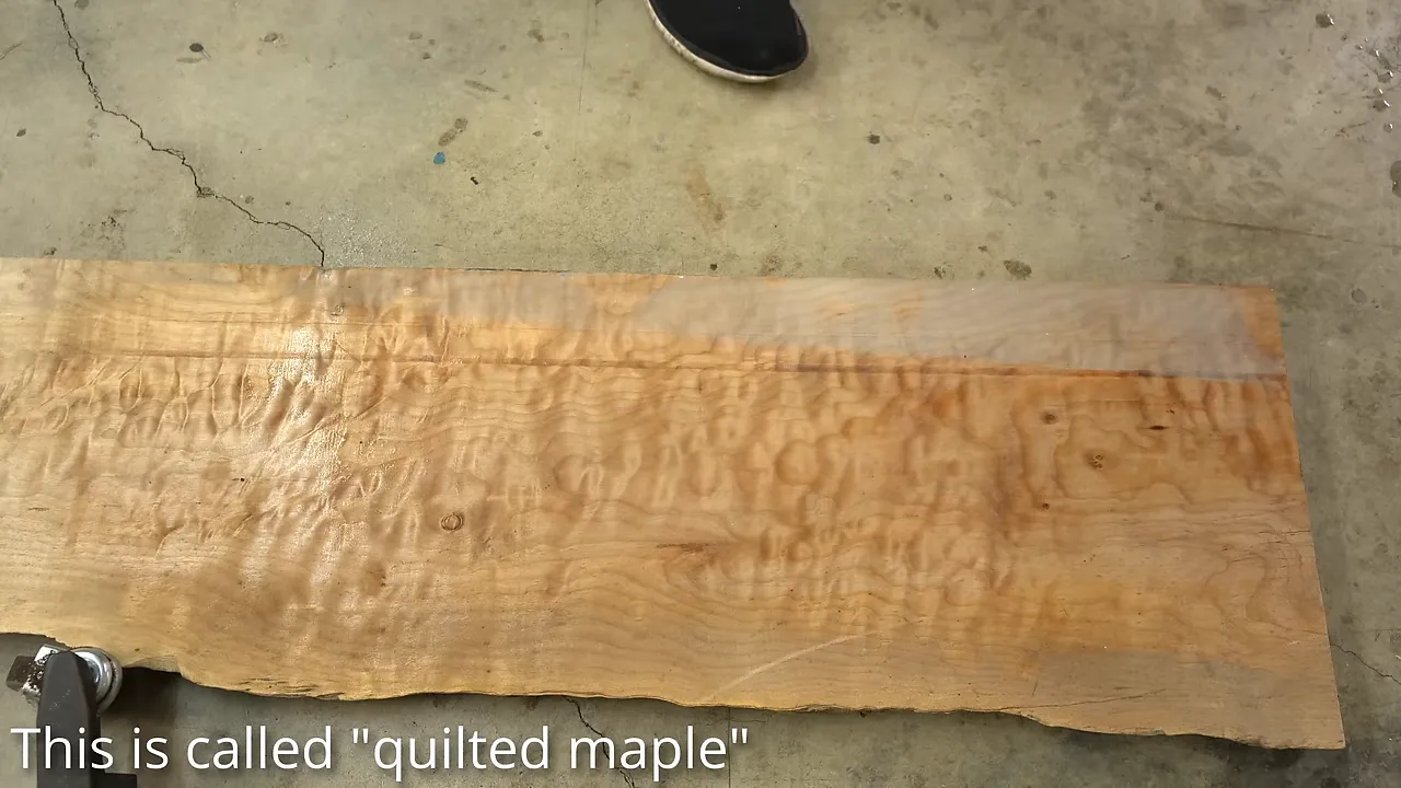 Close-up of a quilted maple board showing rippling grain