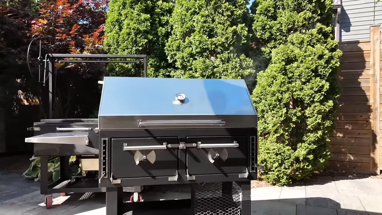 Lone Star Grillz charcoal grill with a stainless steel hood, two front firebox doors, and wheeled cart