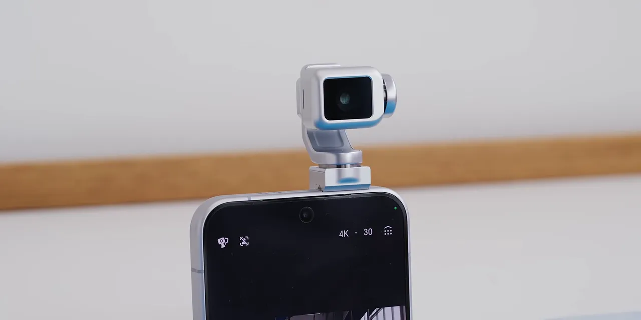 Honor phone standing upright with its small gimbal camera extended above the body